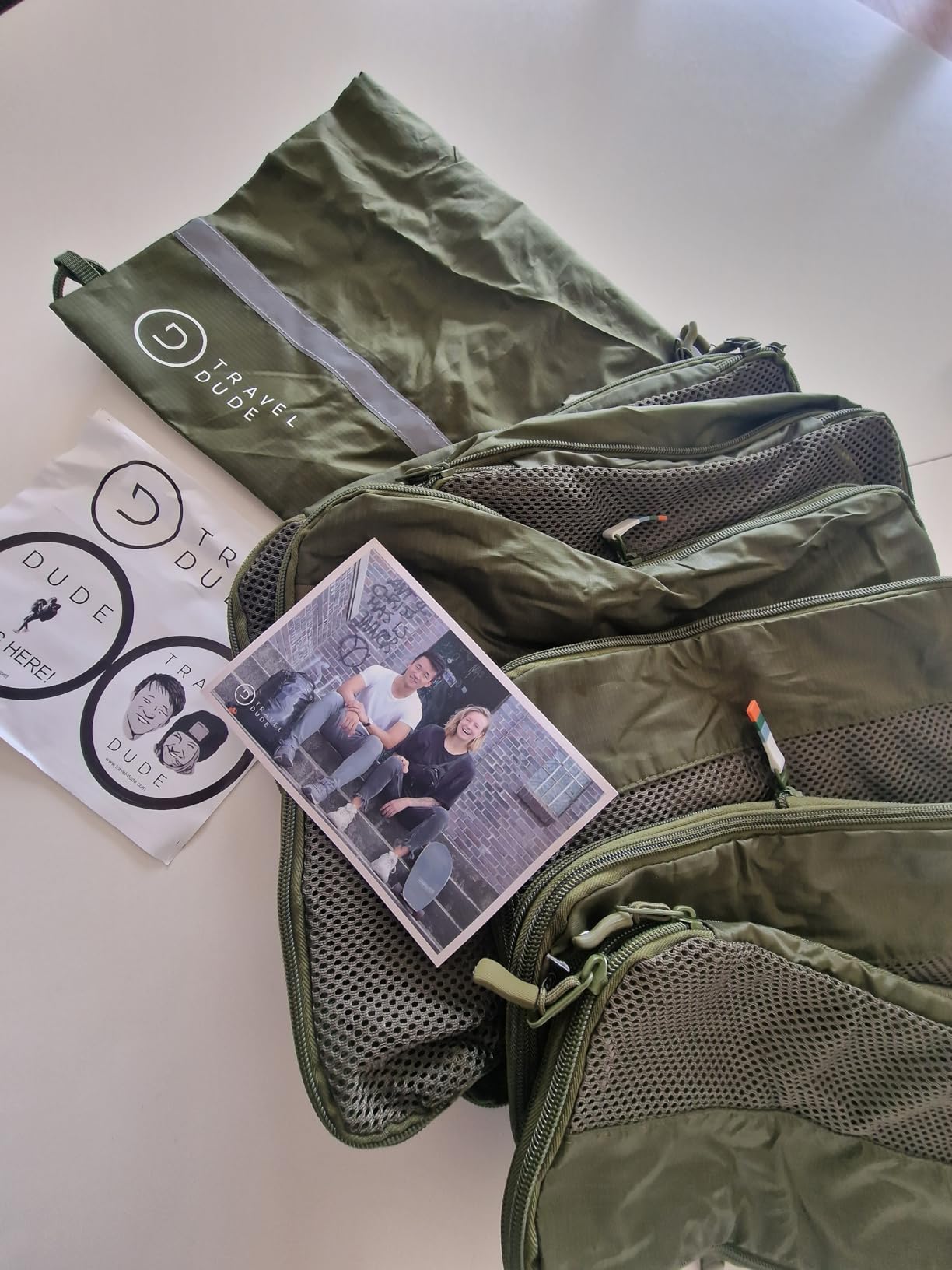 Set of green Travel Dude packing cubes for compact and efficient packing