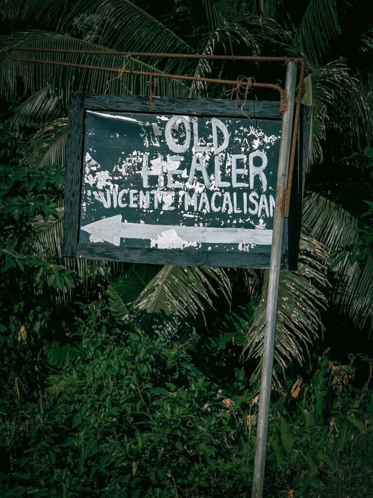 Sign showing directions to an old healer in Siquijor