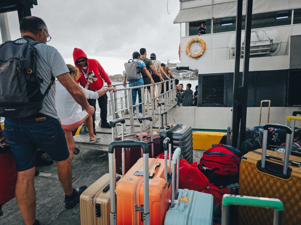 Passengers boarding a boat to Siquijor with their luggage