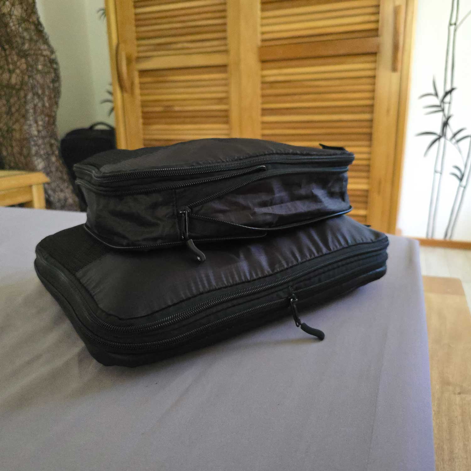 Set of black Travel Dude packing cubes for compact and efficient packing